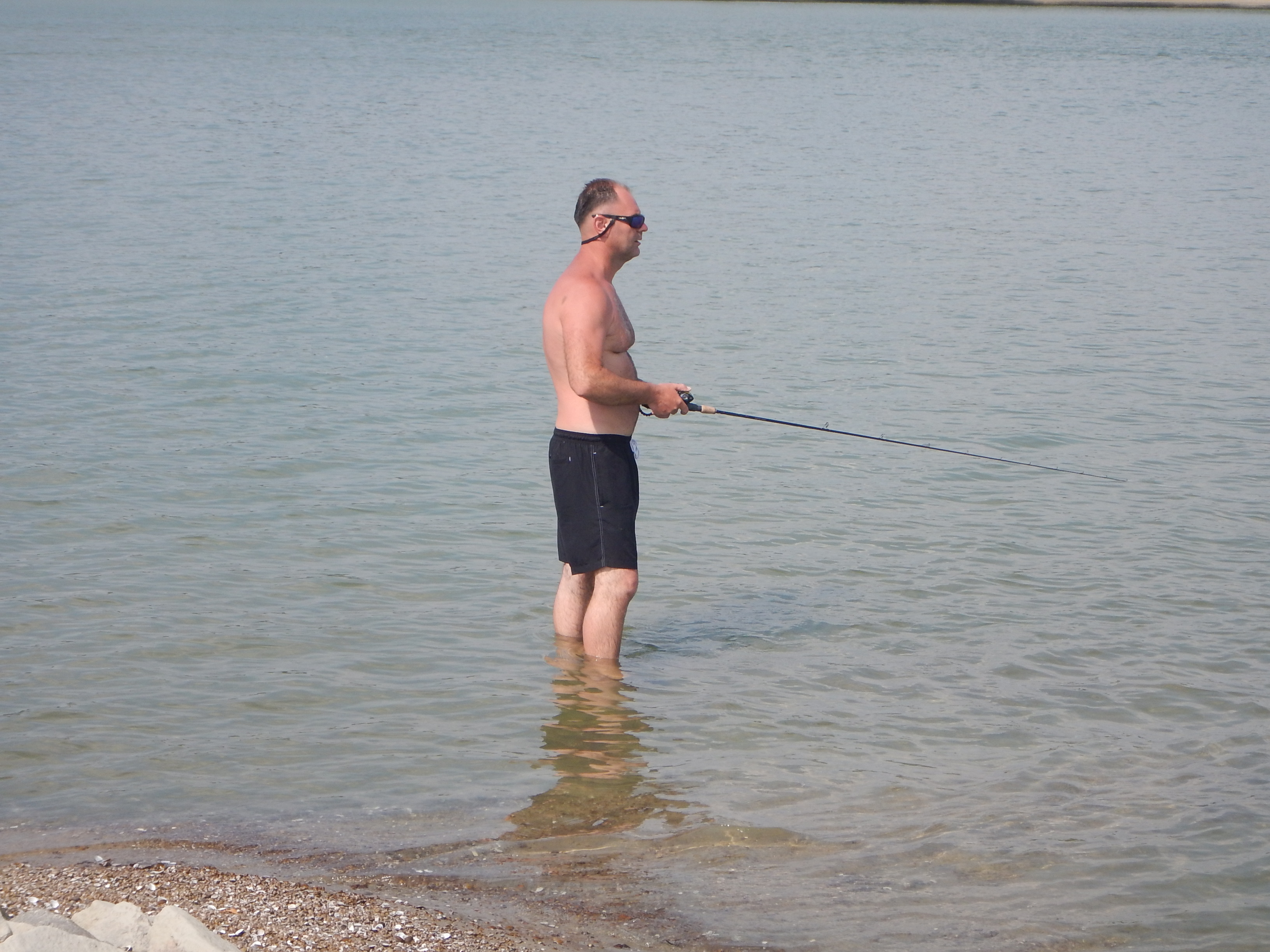 Horgász a vízben